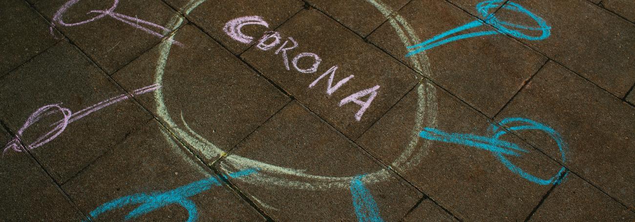 Corona chalk drawing on the ground